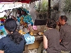 Douala breakfast: woman cooking at omlete table