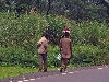 Malong-Dschang road: man head-carrying a chain saw