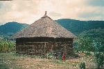 Small boy by a tall house, Ethiopia