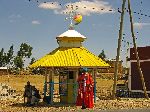 Priest at the roadside ready to bless travelers and solicit contributions, Ethiopia