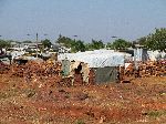 Classic UNHCR tarp as roofing, May Ayeni refugee camp, Ethiopia