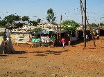 Power poles and lines with electrical service to houses, May Ayeni refugee camp, May Ayeni, Ethiopia