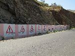 Ethiopian Road Authority Mural of traffic signs, hill between Adi Arkay and Tekeze River, Ethiopia