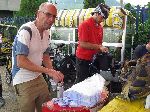 Ghana, refilling water bottles with sterile water from sachets