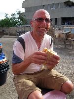 Ghana, eating omlet sandwich