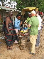 Ghana, buy a snack of roasted plantain and peanuts.