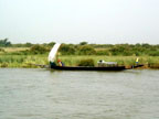 Sailing canoe approaching Mopti, Mali