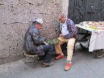 Men playing checkers, souk, Marrakesh, Morocco