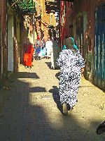Woman walking in Souk, Marrakesh, Morocco