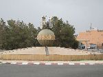 Oversize film spools incorporated in to the sculpture in a traffic circle.Ouarzazate, Morocco