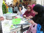 Women eating snails, Fez, Morocco