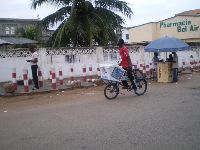 Lome, Togo, Fan Milk ice cream bicyclist