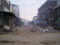 Lome, Togo, street scene with potholes and liter