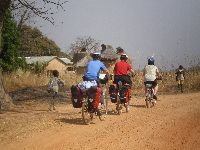 bicycling past Tembera/Otimari houses, Togo