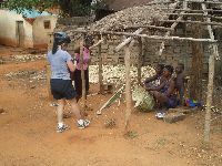 Azove, Benin, woman making and selling baskets
