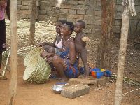 Azove, Benin, woman making and selling baskets