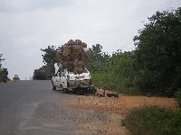 Azove, Benin, taxi with mechanical problem under repair