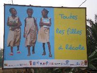 Benin, All the girls to school campaign sign