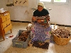 Woman spinning wool, weaving coop, Ain Draham