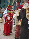 Traditionally dressed woman in Kairouan market