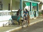 Selling produce from a bicycle, Cuba