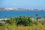 View west, tank farm, across Bay of Matanzas, Cuba