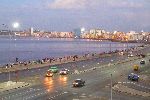 Youth gathered on the Malecon at dusk, Havana, Cuba