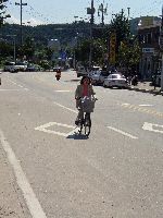 Woman doing errands by bicycle, Gapyeong