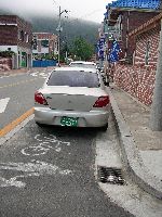 Car parked in bike / walking lane, Hwacheon, South Korea
