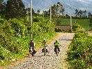 Ecuador, Chaupi, bicycling on cobblestone road