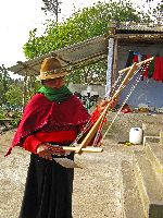 Ecuador, Salasaca: Woman winding yarn on frame
