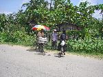 A vendor sells his snacks by bicycle, Guyana