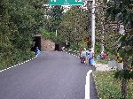 women walking the road picking up garbage