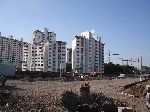 Jeju City expands out into the farm land