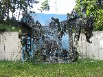 Sculpture of a famous picture of refugees clambering across a destroy bridge on the Daedong-River.