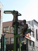 sculpture of boys on a light pole, Gwangbok-ro, Busan