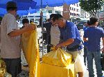 Wrapping gift boxes of food in cloth for Chusok, Korea