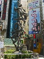 Sculpture and art among skyscraper, Myeongdong, Seoul