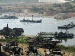 Army training deconstructing a temporary bridge across the Han River, Korea