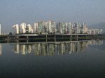 High rise residential towers reflect in the Han River, Korea