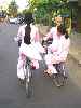 Veitnamese high school students on bicycles