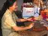 incense maker demonstrates her craft