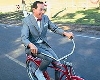 Paul Reubens, a.k.a. Pee-Wee Herman, bicycling
