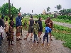 Kumba-Buea road: people coming back out into the open after the rain has ended.