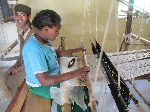 Weaving with loom, Plowshares Women's Craft Training Center, Woleka, Ethiopia
