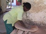 Preparing clay for pottery, Plowshares Women's Craft Training Center, Woleka, Ethiopia