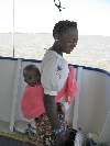Boat passengers, a girl and her sister