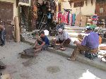 Metalworkers in the medina, Seffarine Square, Fez, Morocco