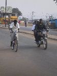 Sokode, Togo, bicyclist and motorcycle