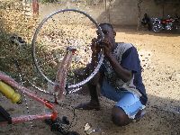 Sokode, Togo, mechanic repairing bicycle